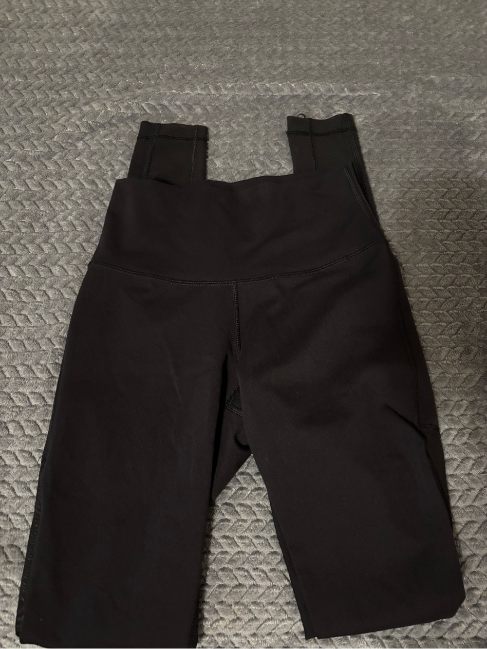 Black Lululemon leggings with mesh design on back (size 2)